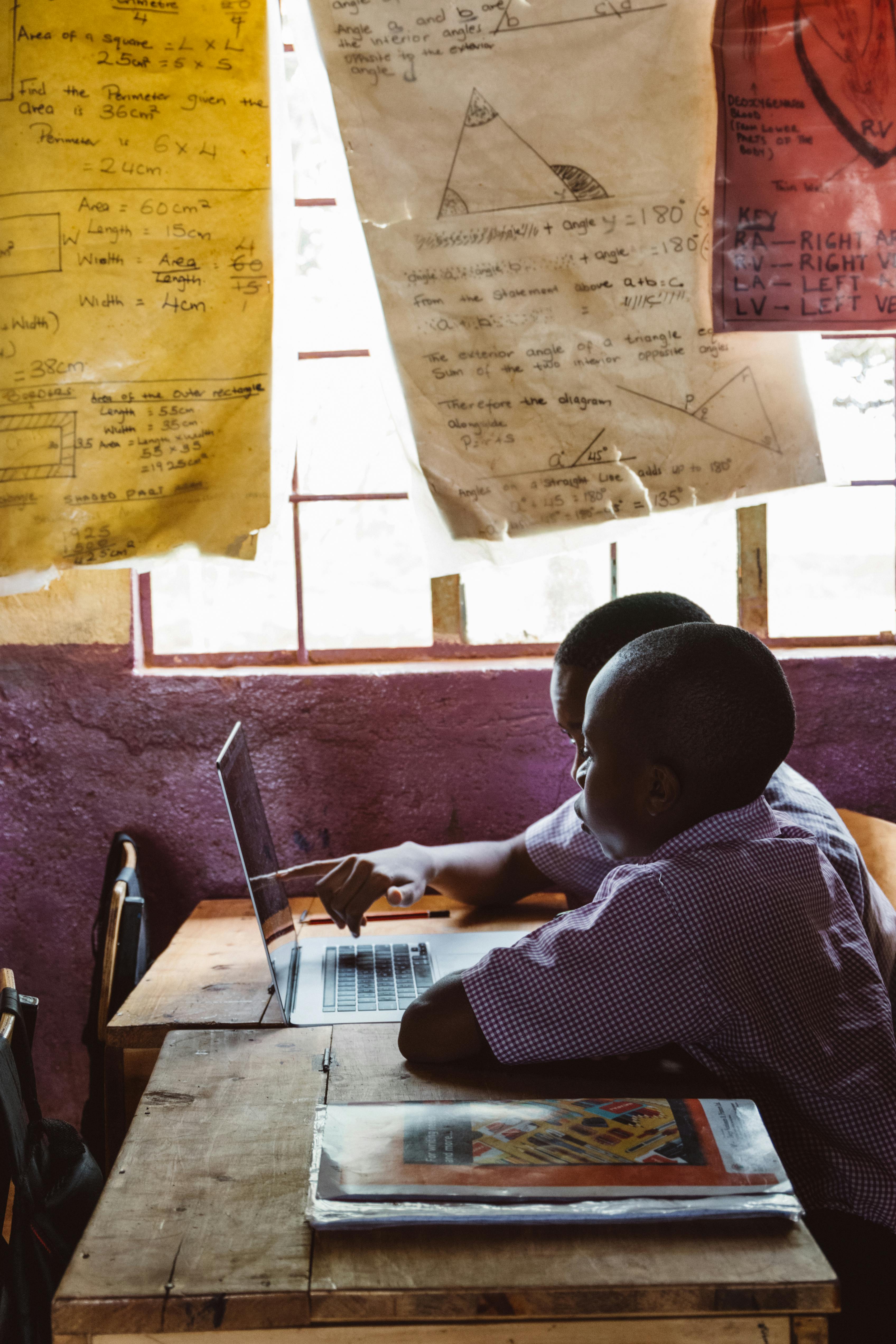Students collaborating in an African classroom
